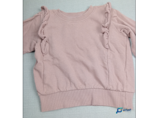 Pull rose fille